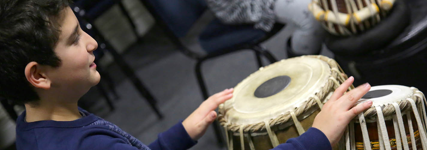 Child playing tabla