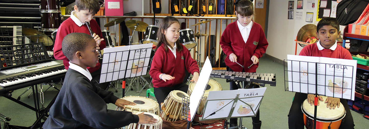 School group playing tabla